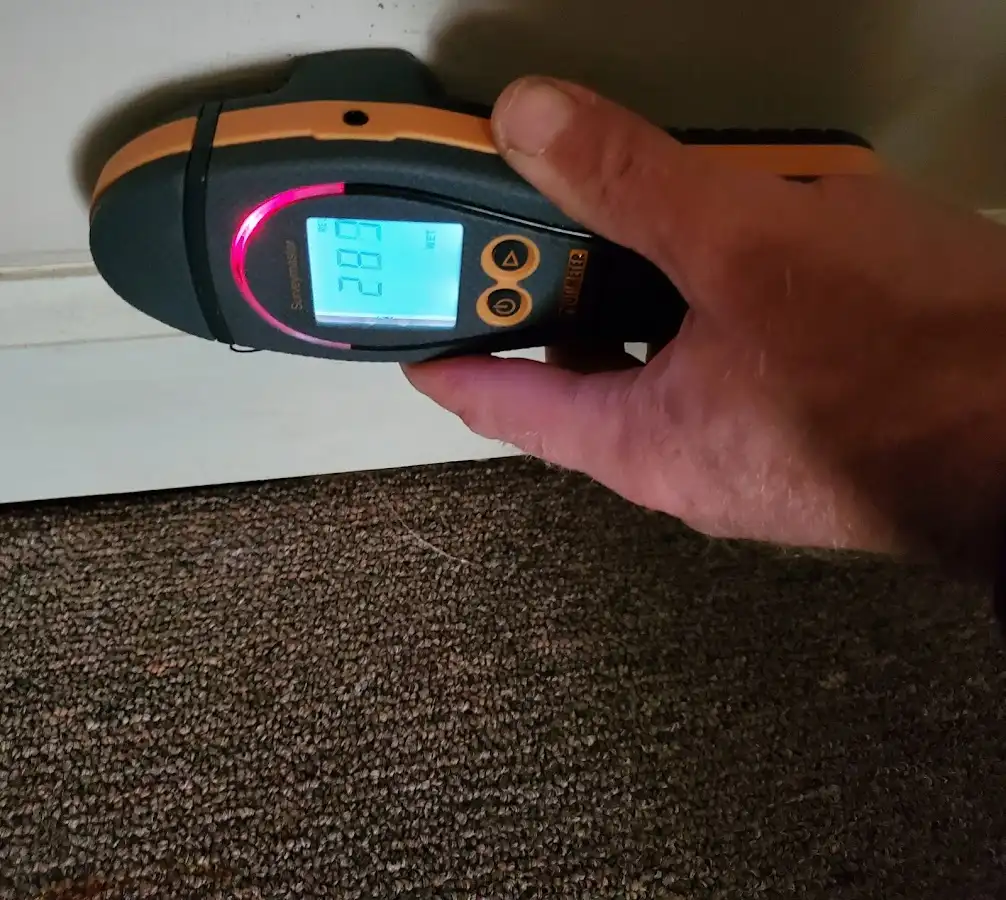 Moisture detection at baseboard during Storm Damage Restoration in Harriman